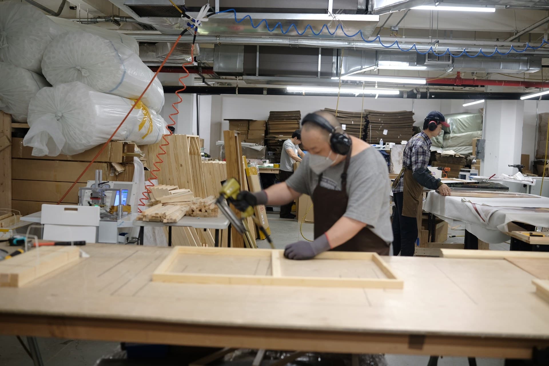 Still Graphic team building canvas frames in the New York studio